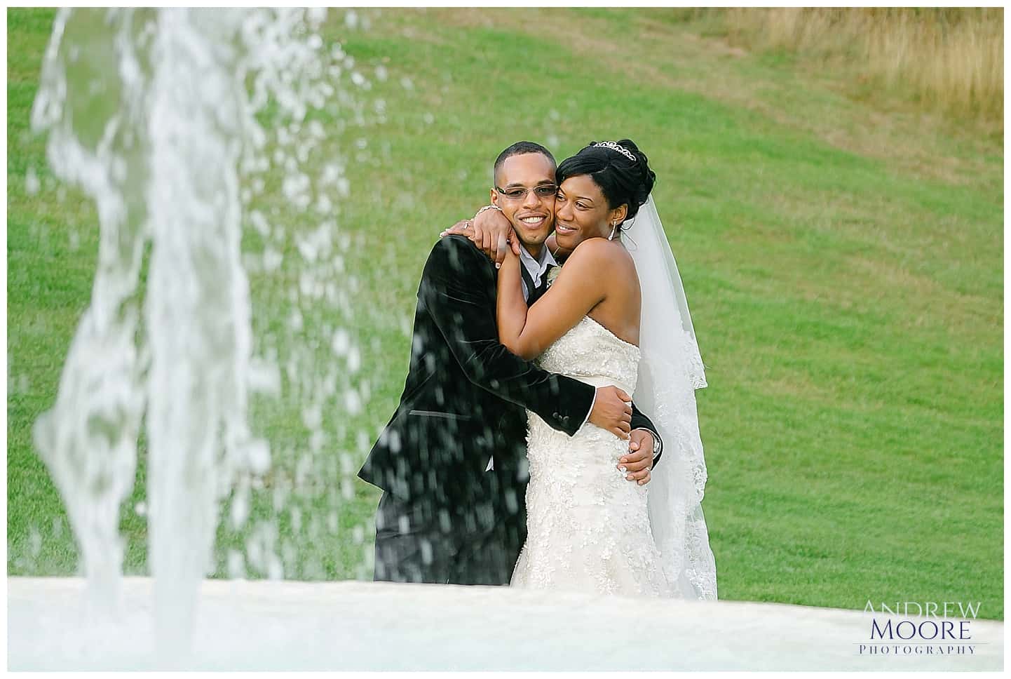 bride and groom by fountain at addington palace 