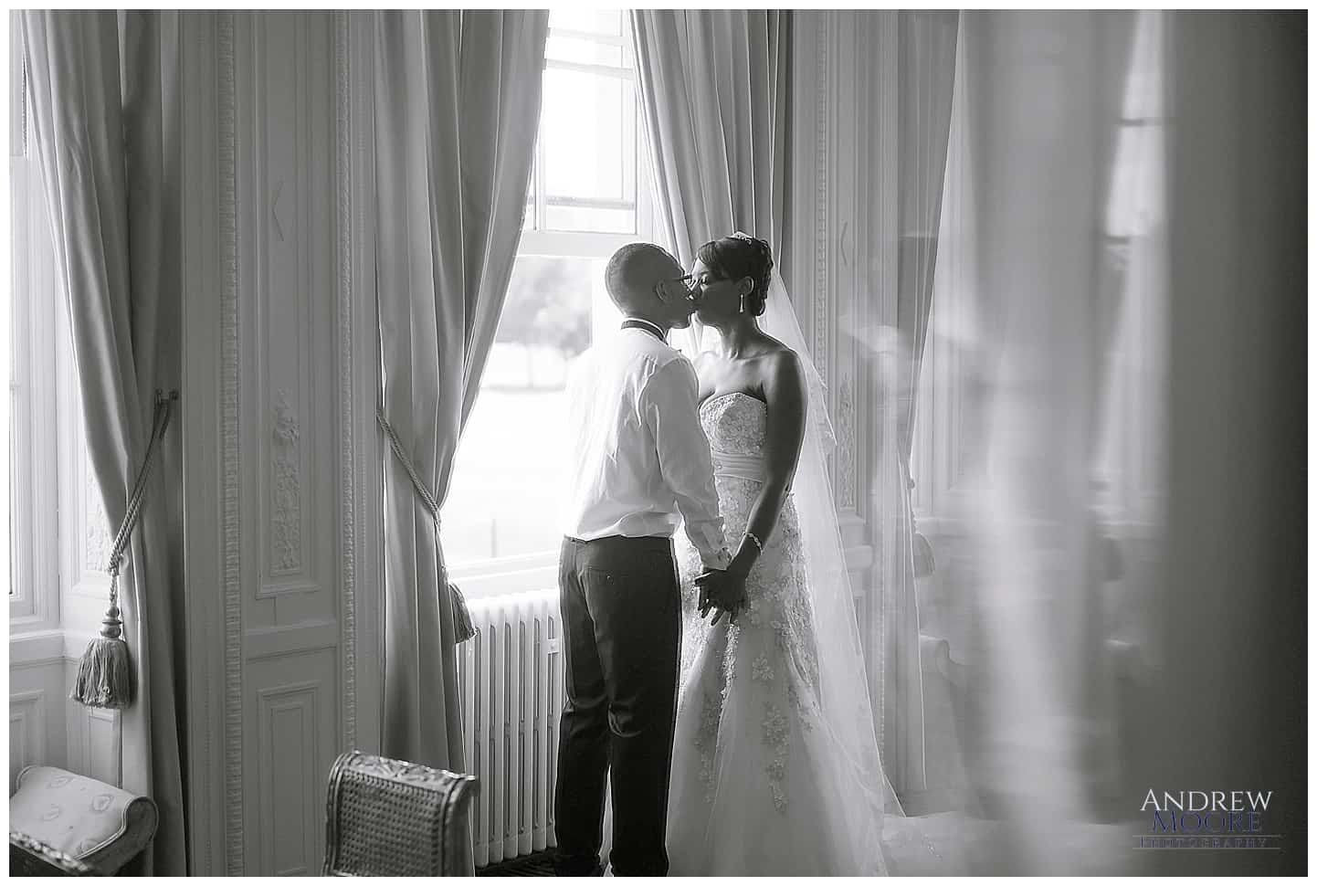 black and white photo in mirror of wedding couple 
