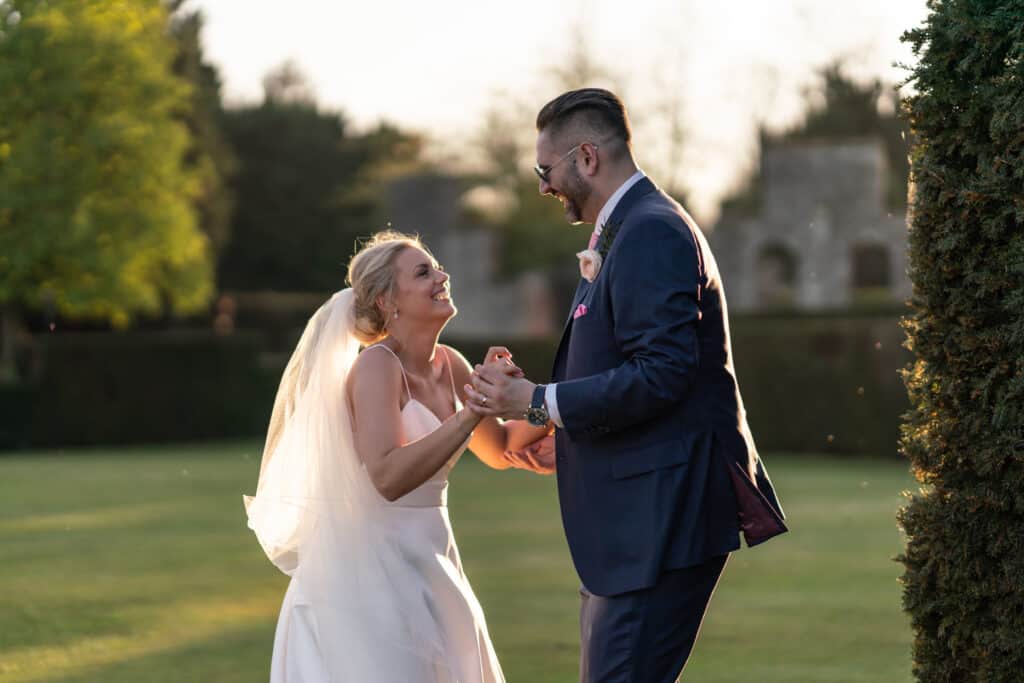 Eastwell Manor Wedding Bride and groom natural fun photography