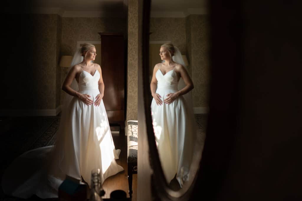 beautiful bride reflected in mirror