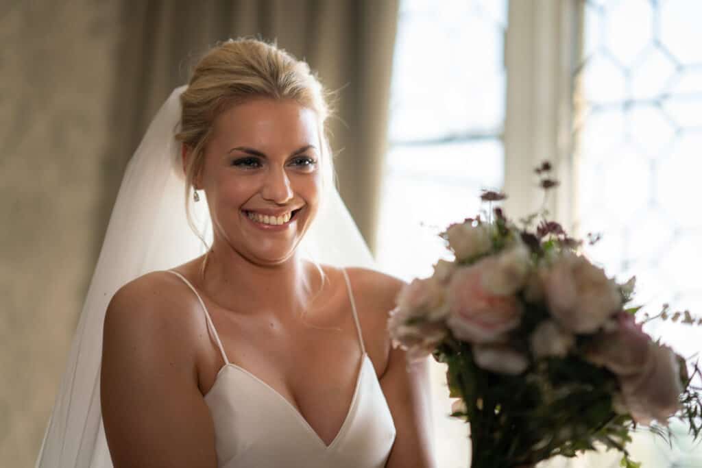 happy bride with flowers