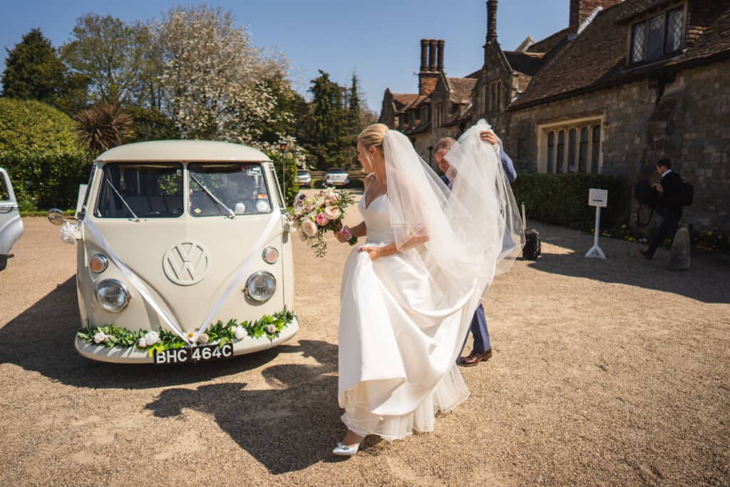 Bride with retro wedding VW campervan