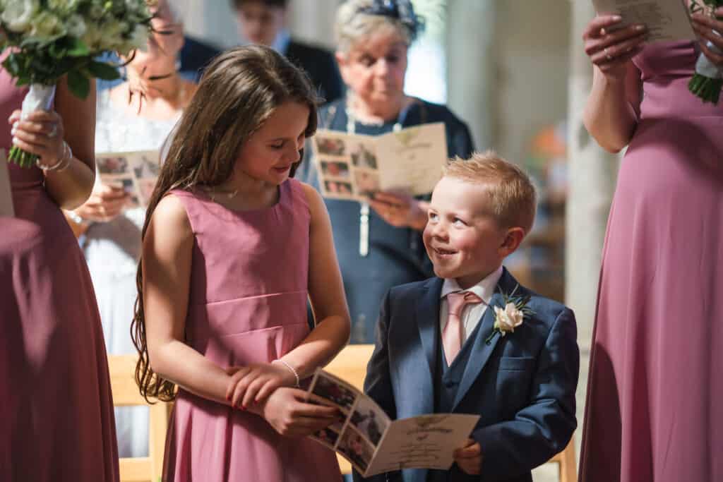Flower girl and page boy in church