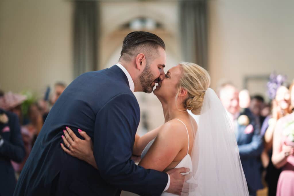 Bride and groom first kiss