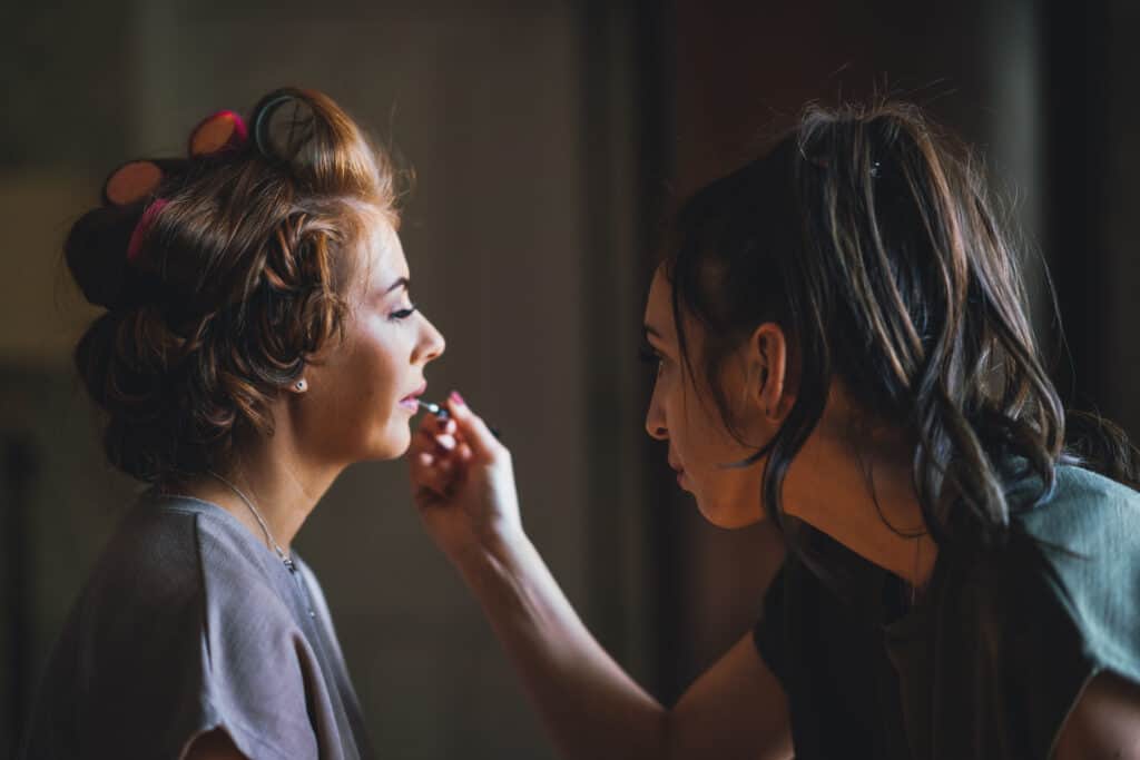 bridesmaid getting makeup done