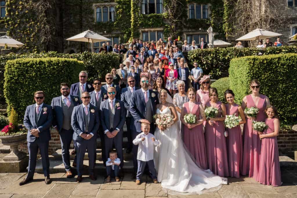 Eastwell Manor wedding group photograph of wedding party and guests