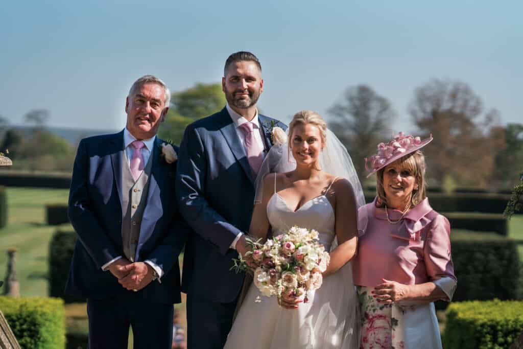 bride and groom with parents