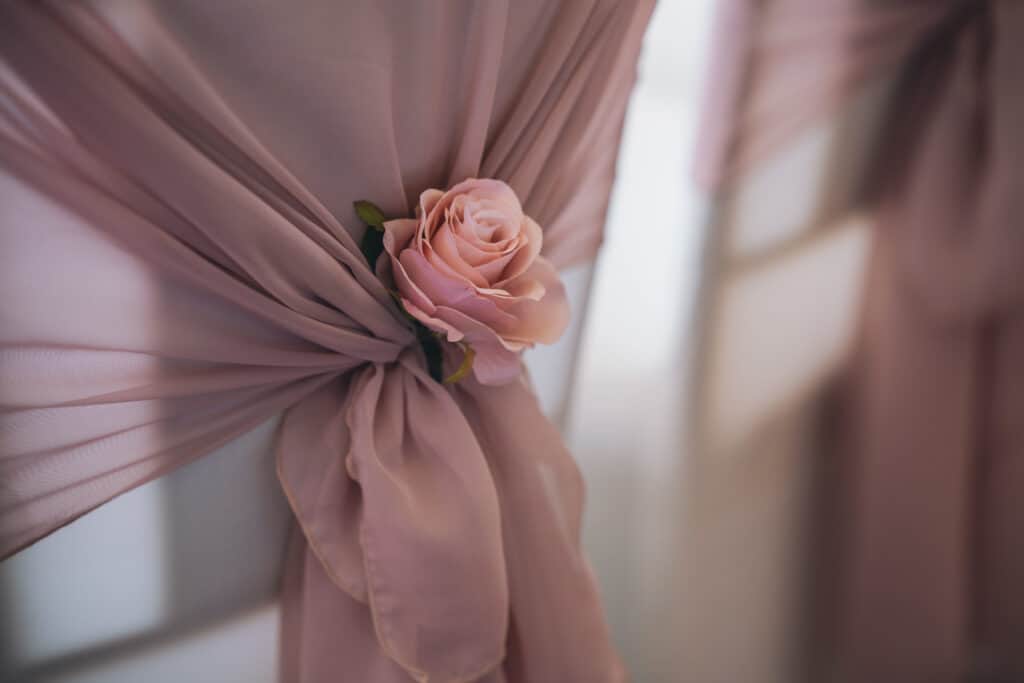 Wedding chair decoration pink with a rose