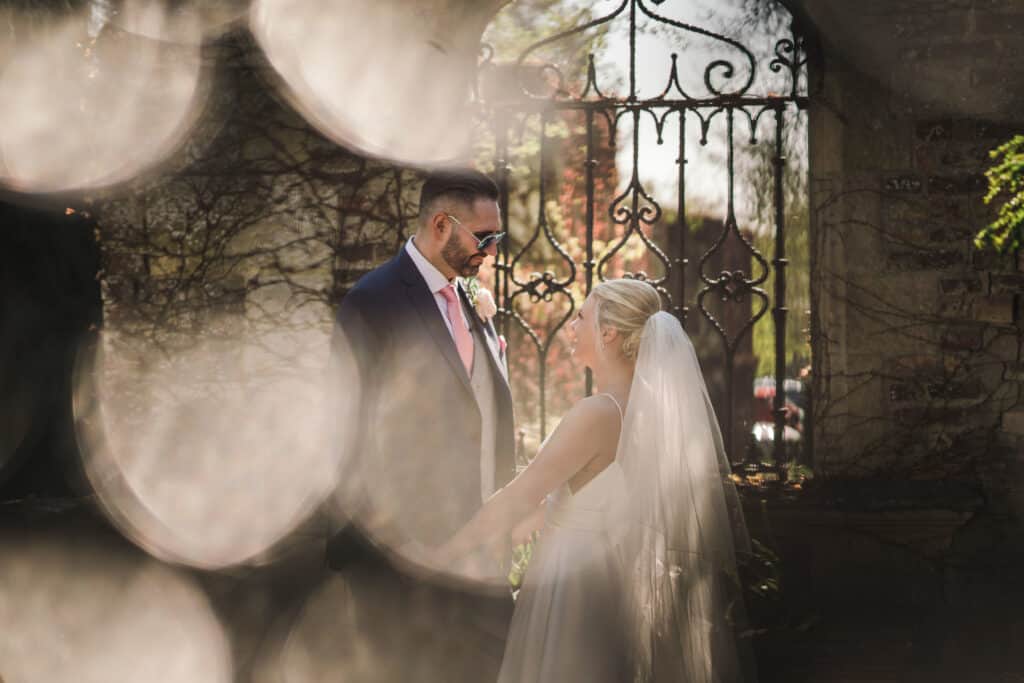 Bride and groom by beautiful gate