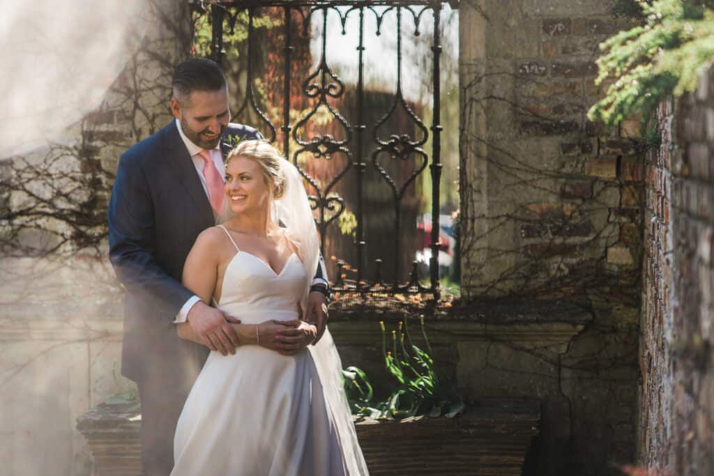 Bride and groom by beautiful gate