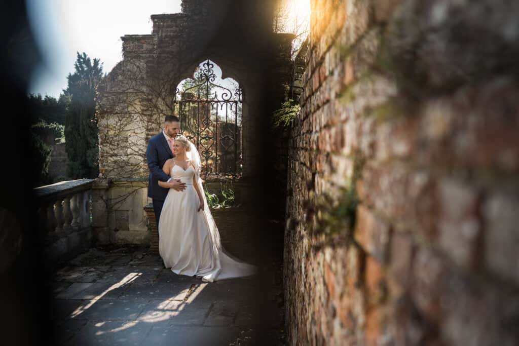 Bride and groom portrait photo by beautiful gate