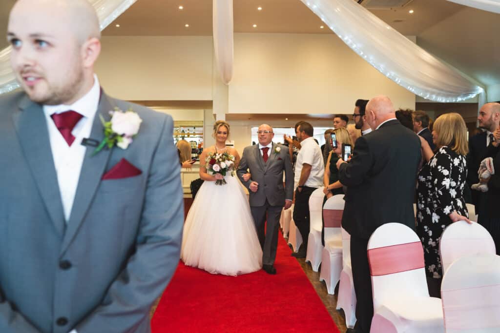 Bride coming down the aisle Weald of Kent Wedding