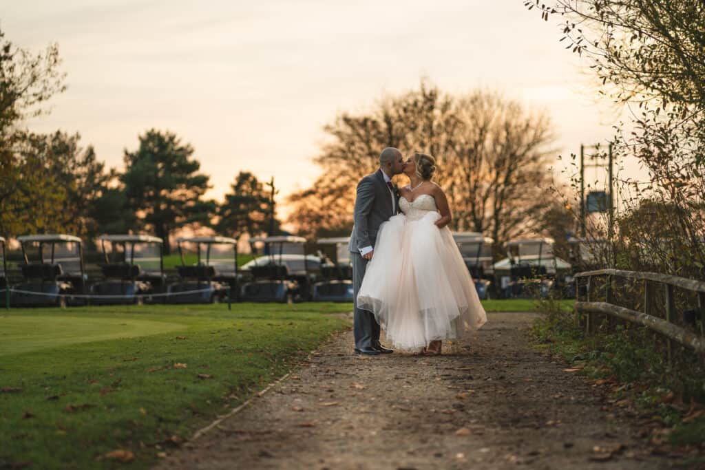 Bride and groom portrait photography on grounds of Weald of Kent wedding venue