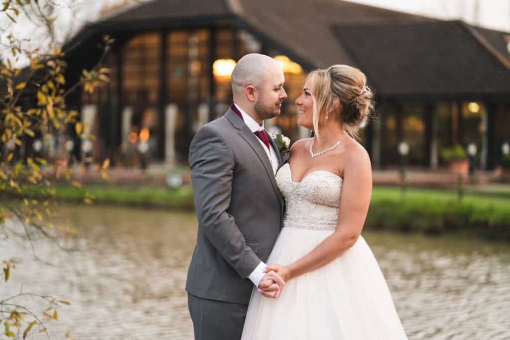 Bride and groom portrait photography on grounds of Weald of Kent wedding venue