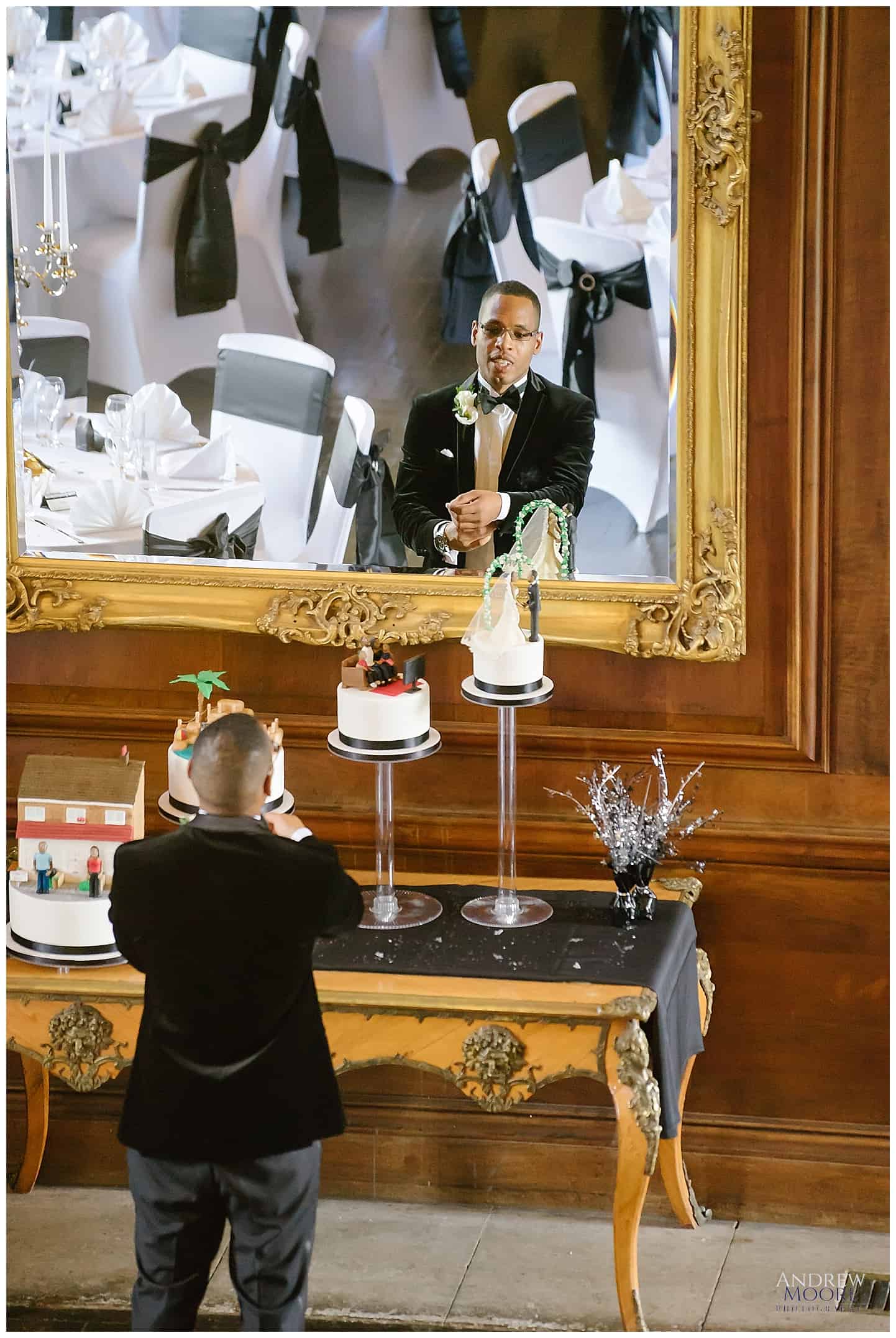 groom getting ready in mirror at Haddington palace