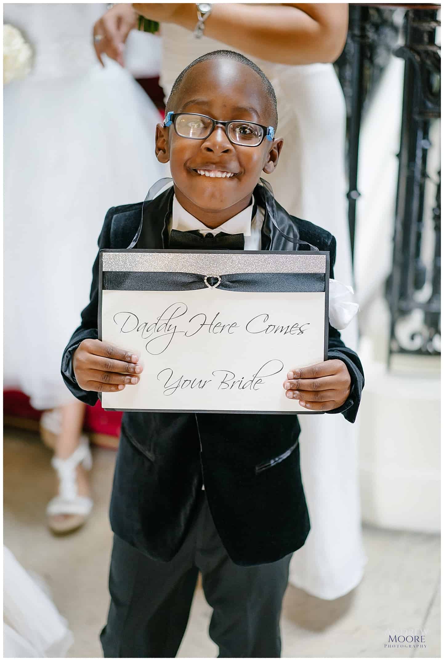 cute boy carrying wedding sign at Haddington palace wedding 