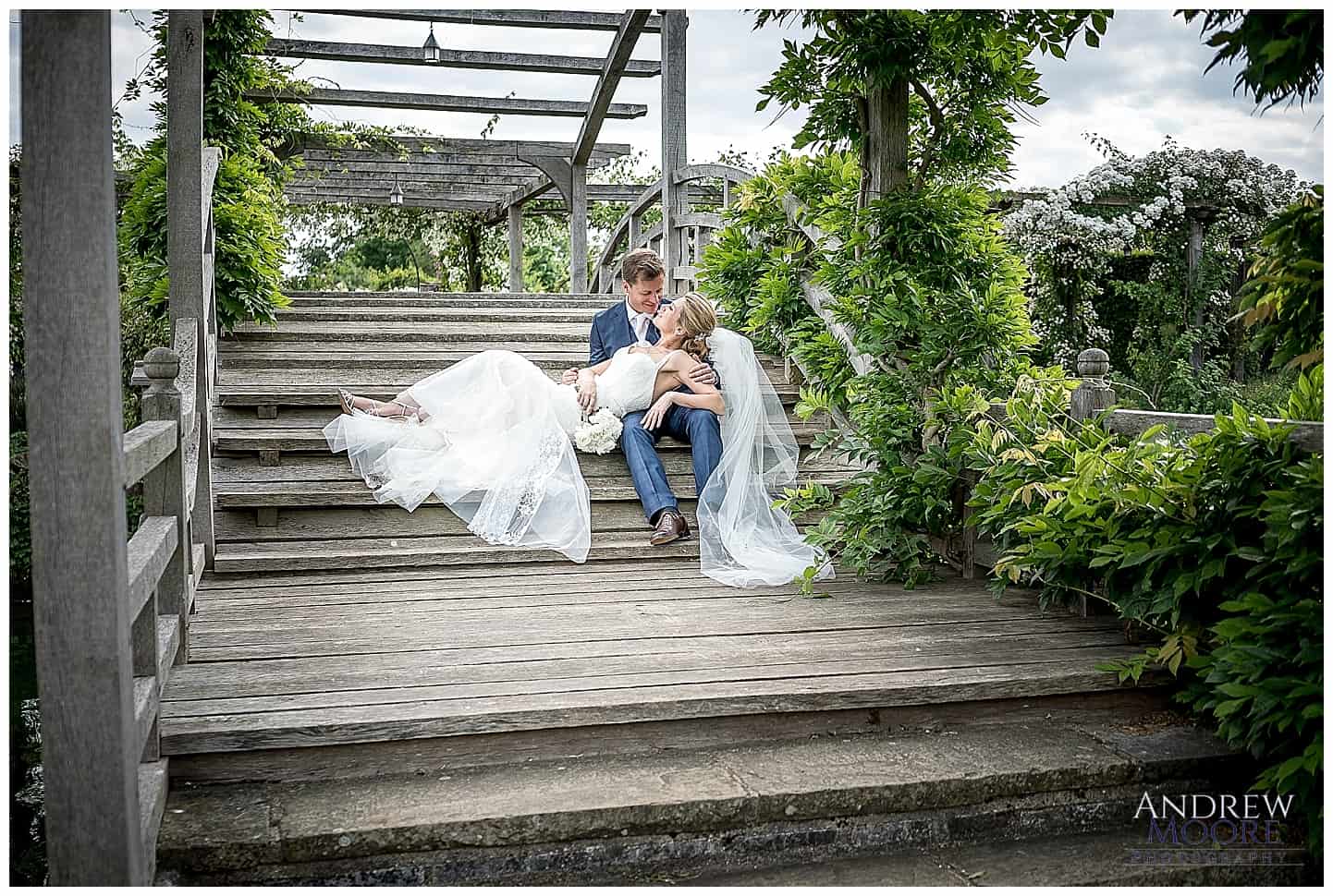 Great fosters wedding couple on wooden bridge .jpg