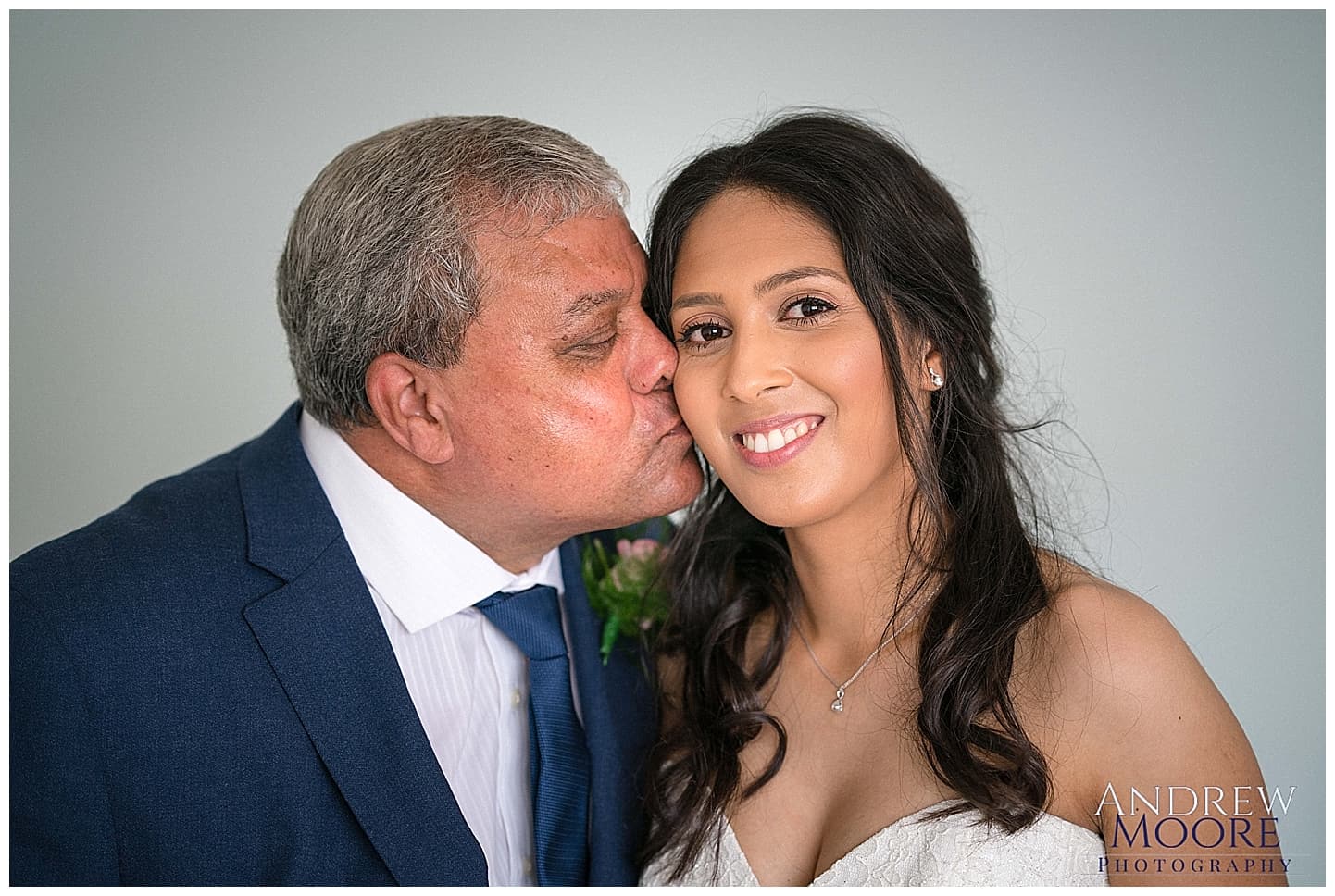 wedding, beautiful bride being kissed by dad