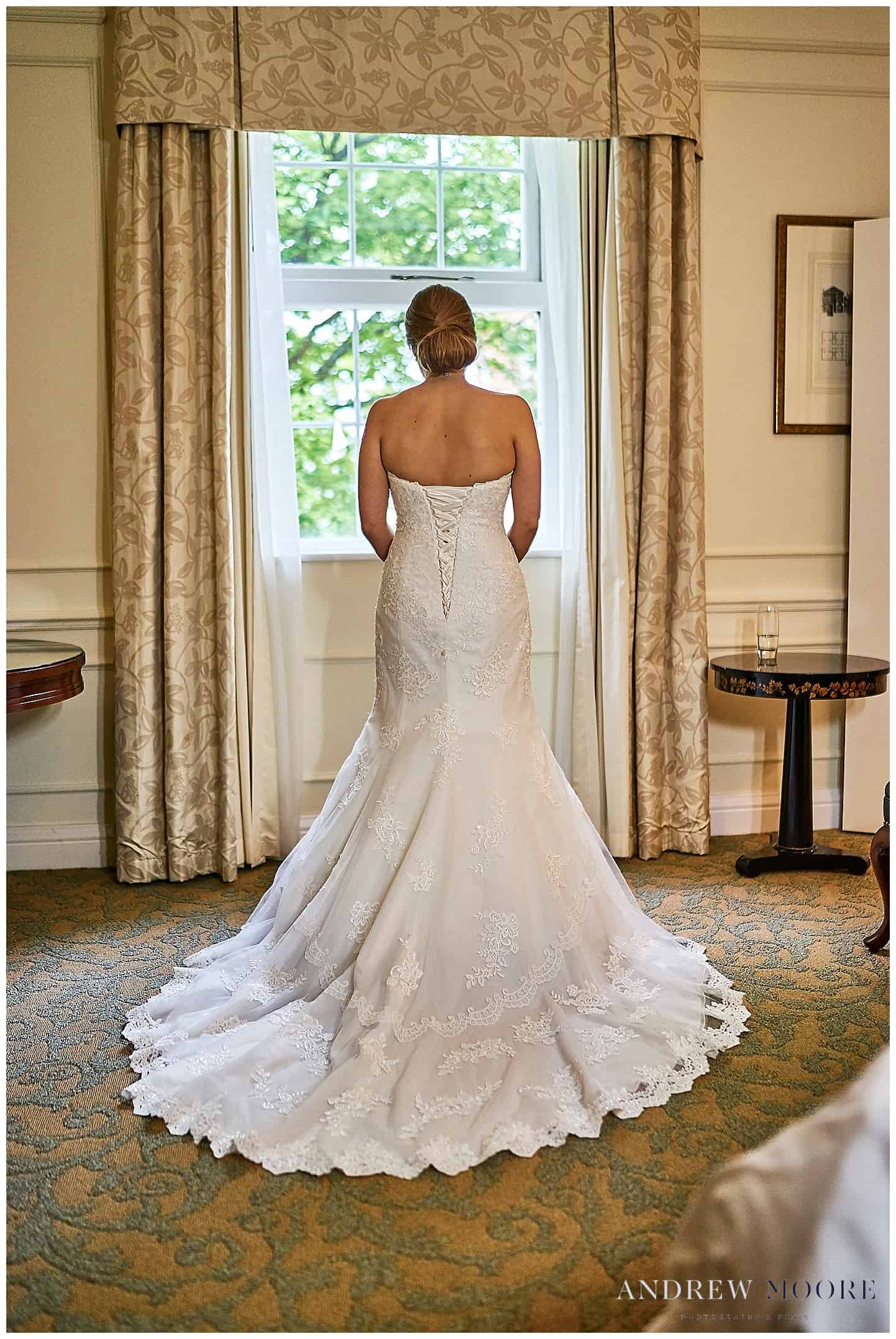 beautiful wedding dress bride stood in window