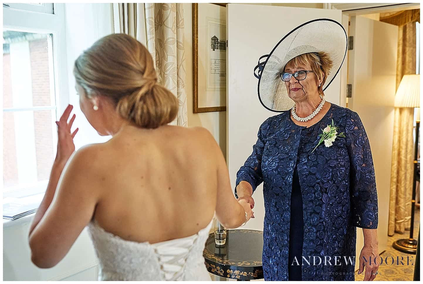 emotional mother when seeing bride in dress for first time. cain manor and four seasons hotel 