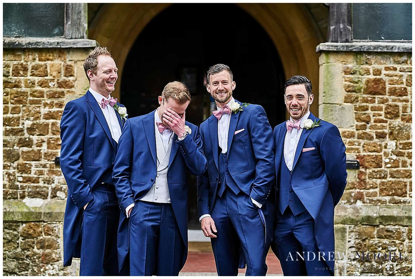 laughing groomsmen at grayshot st Luke's church surrey