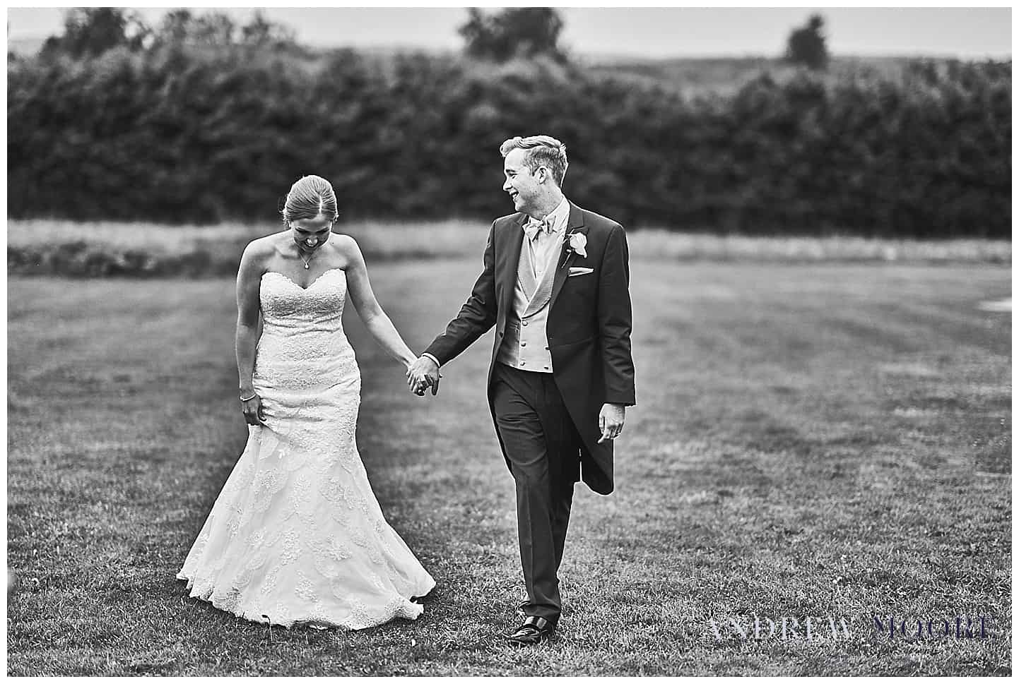 married couple walking on wedding day at cain manor