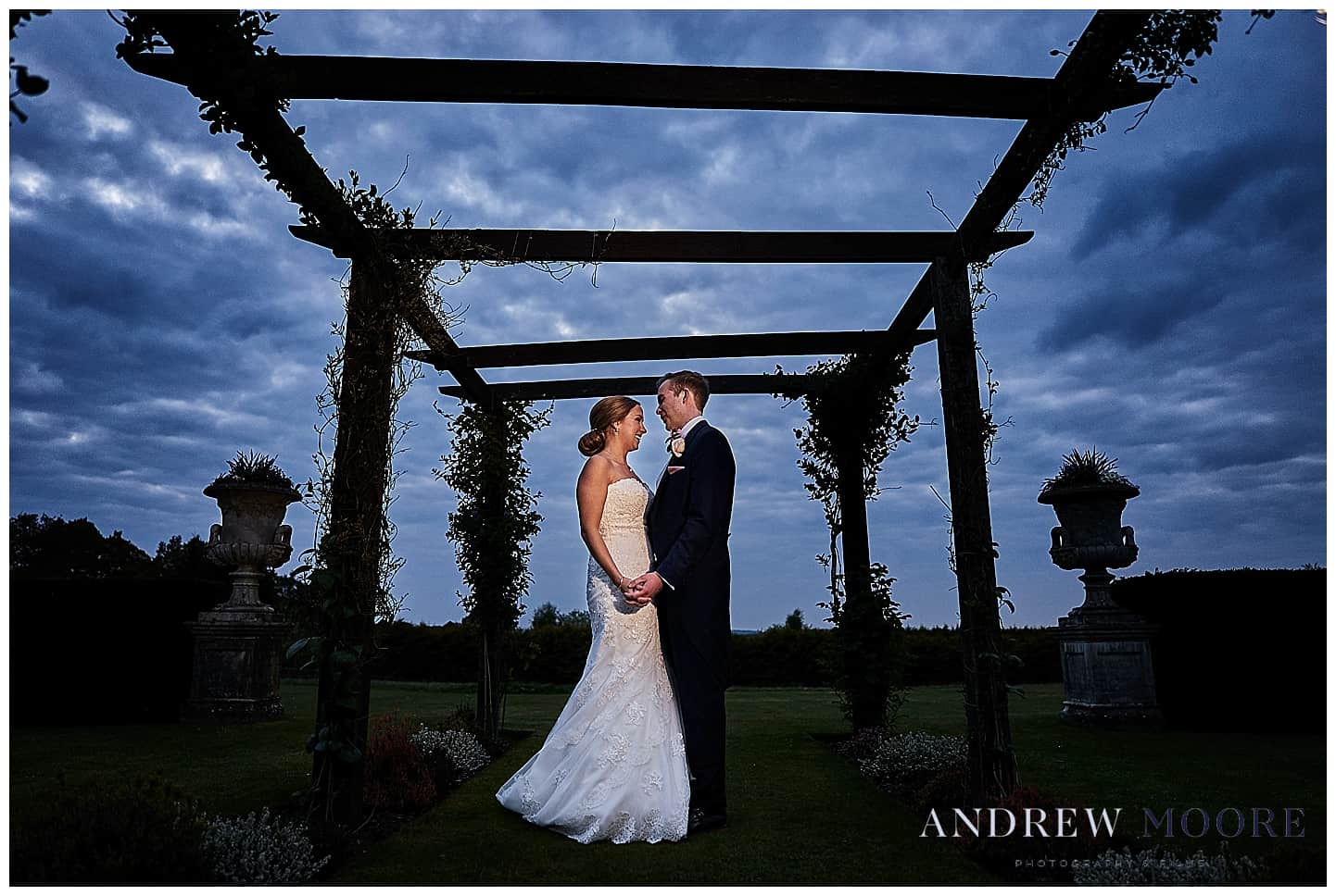 bride and groom under canopy at cain manor wedding venue 
