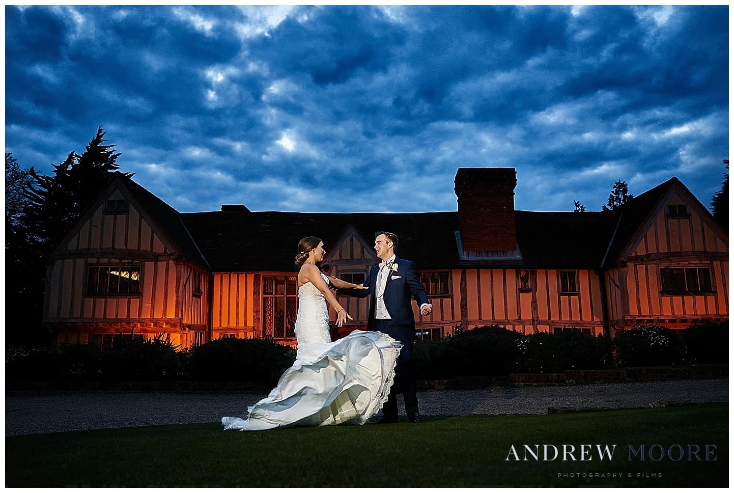 epic shot of bride throwing her dress night time wide photo cain manor 